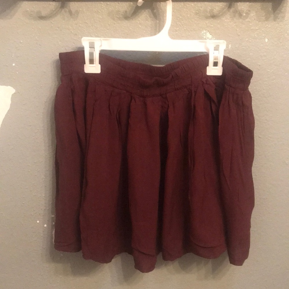 a maroon skirt